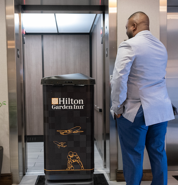 Hotel delivery robot autonomously entering elevator