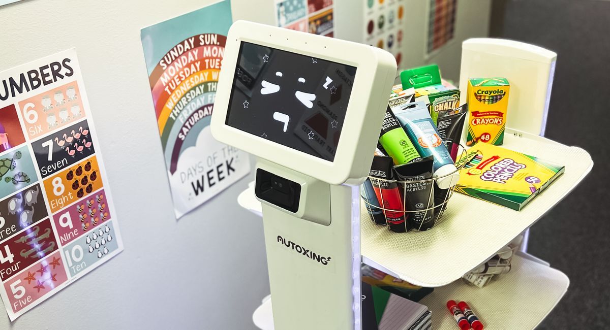 Classroom robot carrying craft supplies