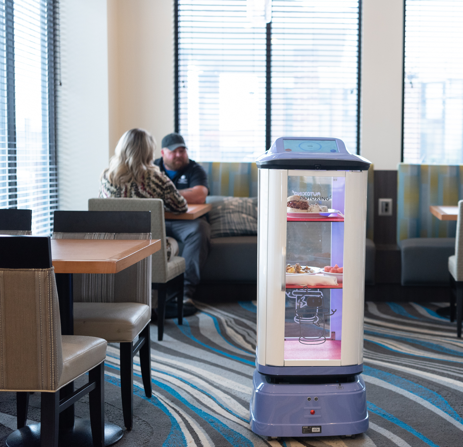 Autoxing enclosed waiter robot serving restaurant guests