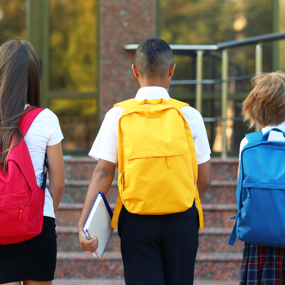 students walking into school